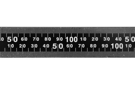 Part of black metal scale ruler isolated on white background closeup
