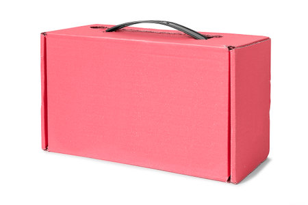 Pink blank carton packaging box with a handle isolated over whiteの写真素材