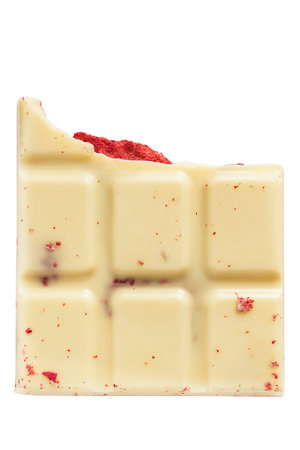 Piece of white chocolate with berry filling isolated over white