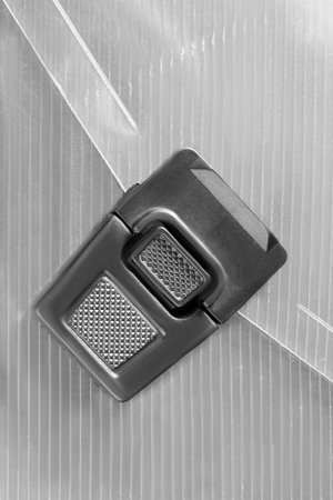 Clasp lock on plastic flap bag closeup as a background
