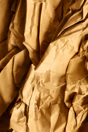 Crumpled brown wrapping paper closeup as a backgroundの写真素材