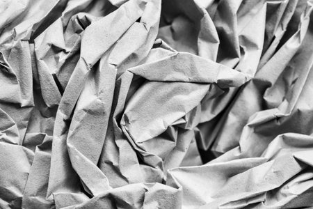 Crumpled gray wrapping paper closeup as a backgroundの写真素材