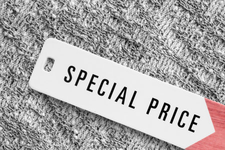 Special price tag label over knit fabric background closeupの写真素材