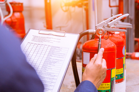 Engineer checking Industrial fire control system,Fire Alarm controller, Fire notifier, Anti fire.System ready In the event of a fire.の写真素材
