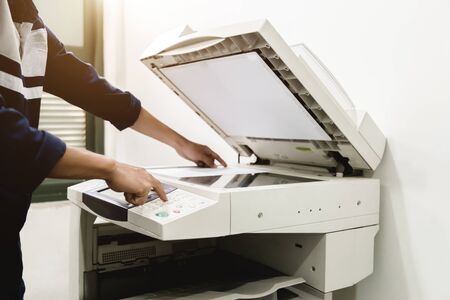 Business people keypad hand on the panel printer, printer, scanner, laser copier, office equipment, concept, start workingの写真素材