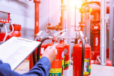 Engineer checking Industrial fire control system,Fire Alarm controller, Fire notifier, Anti fire.System ready In the event of a fire.の写真素材