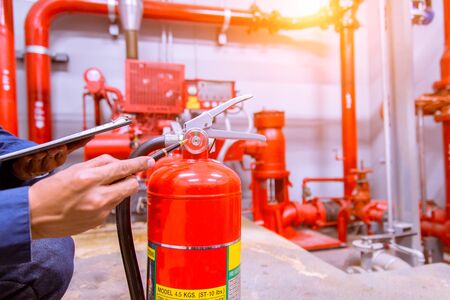 Engineer checking Industrial fire control system,Fire Alarm controller, Fire notifier, Anti fire.System ready In the event of a fire.の写真素材