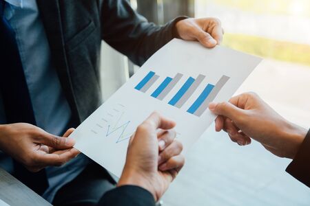 Businesspeople partners discussing documents and ideas at discussing together in conference room during meeting at office .の写真素材