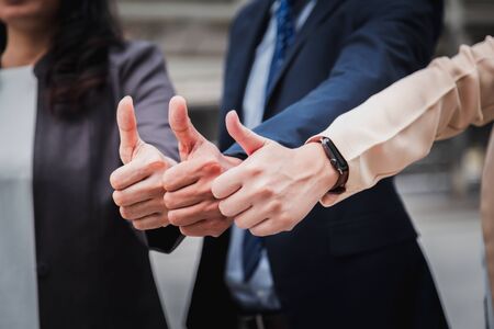 Group businesspeople thumbs of different business people pointing up.の写真素材