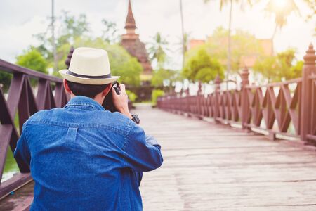 Young man travelers are enjoying archaeological attractions. And enjoy digital photography.の写真素材
