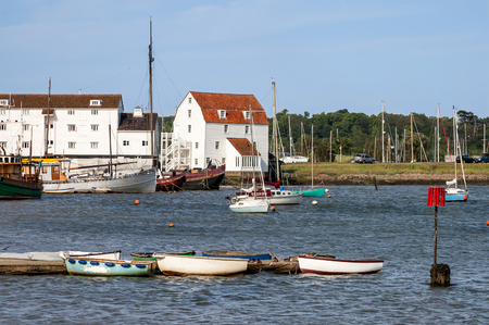 WOODBRIDGE, ENGLAND - JUNE 2006: Moorings, boats and Woodbridge Tide Mill, River Deben,  Suffolk, East Anglia, England, UKのeditorial素材
