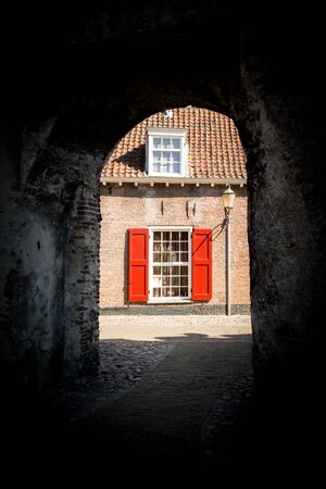 Medieval fortress city wall gate Koppelpoort and Eem River in the city of Amersfoort - tourist destination near Amsterdam, Netherlandsのeditorial素材