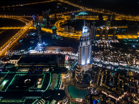 Aerial night view from Burj Khalifa of the Address Downtown Dubai skyscraper, Dubai Mall, Old Town Island and Sheikh Zayed Road in downtown Dubai, United Arab Emiratesのeditorial素材