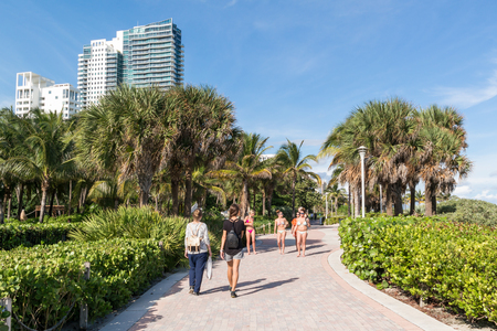 People walking on South Beach Boardwalk in Miami Beach, Florida, USAのeditorial素材