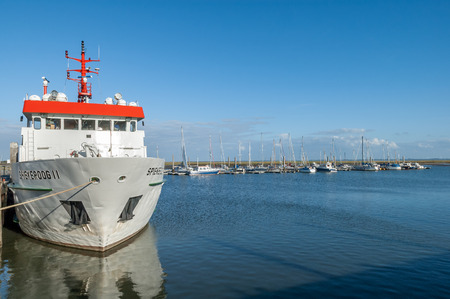 SPIEKEROOG, GERMANY - SEPT 1, 2004: Ferry and yachts in harbour marina of East-Frisian island Spiekeroog, Lower Saxony, Germanyのeditorial素材