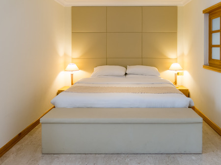 Bedroom with double bed and lamps in hotel in Dubai, United Arab Emiratesのeditorial素材
