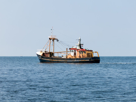 Dutch shrimper or shrimp cutter fishing boat on the Wadden Sea, Netherlandsの写真素材