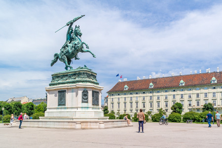 Heldenplatz, Heroes square, with people, equestrian statue of archduke Charles and Hofburg palace in Vienna, Austriaのeditorial素材