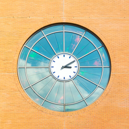Clock in front facade of building in Hilversum, Netherlandsの写真素材