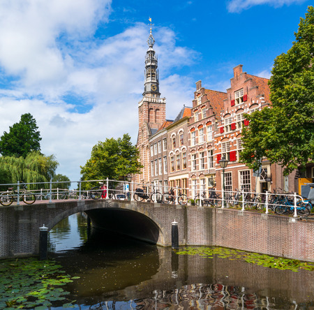 Groenebrug bridge over Steenschuur canal, Louis church tower and gables of old houses in downtown Leiden, South Holland, Netherlandsのeditorial素材