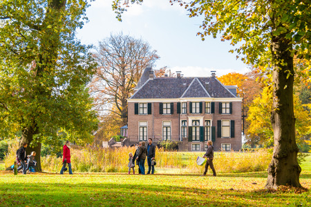 People enjoying sunshine on autumn day in park of estate Boekesteyn, 's Graveland, Netherlandsのeditorial素材