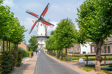 WILLEMSTAD, NETHERLANDS - JUL 28, 2016: Streetscene with traditional windmill in town of Willemstad, North Brabantのeditorial素材