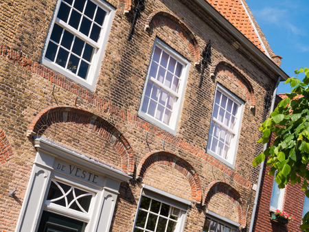 WOUDRICHEM, NETHERLANDS - JUN 4, 2017: Front facade of  historic house de Veste in old town of fortified city Woudrichem, Brabant, Netherlandsのeditorial素材