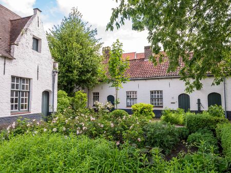 Garden in courtyard of almshouses De Muelenaere, Nieuwe Gentweg, Bruges, Belgiumのeditorial素材