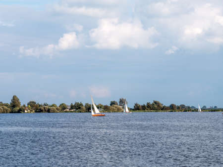 Sailing boats on Pikmeer lake in Grouw, one of Frisian lakes in Friesland, Netherlandsの写真素材