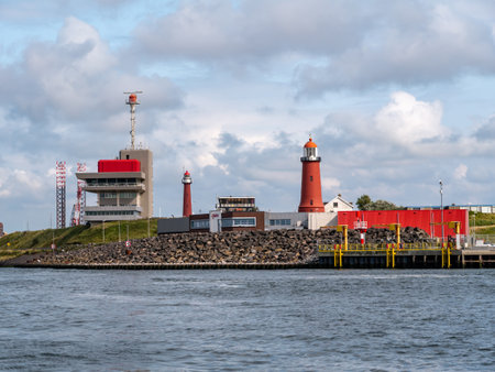 Harbour entrance IJmuiden with port control tower and two lighthouses, North Sea coast Netherlandsの写真素材