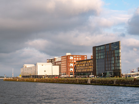 Hotel Jakarta and residential buildings on Java Island peninsula in eastern docklands of Amsterdam, Netherlandsのeditorial素材