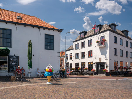 Luitje square with people on outdoor terrace in old town of Zierikzee, Schouwen-Duiveland, Zeeland, Netherlandsのeditorial素材