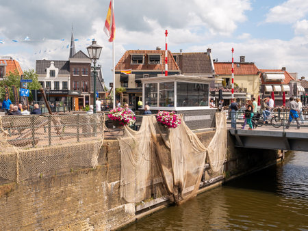 Oudesluis bridge and quay in old town of Lemmer, Friesland, Netherlandsのeditorial素材