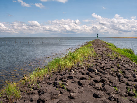Breakwater between IJsselmeer lake and Trintelhaven harbor along Houtribdijk near Lelystad,...