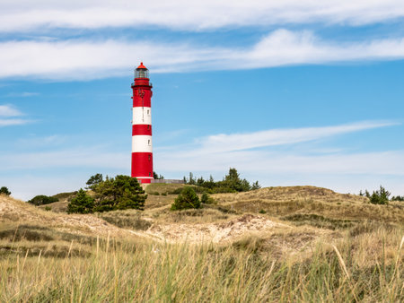 Lighthouse in dunes near Nebel on Amrum island, North Frisia, Schleswig-Holstein, Germanyの写真素材