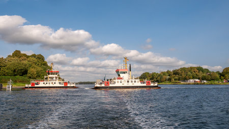 Ferry boats Memel and Kustrin crossing Kiel Canal from Nobiskrug to Schacht-Audorf, Schleswig-Holstein, Germanyのeditorial素材