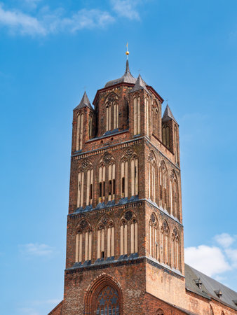 Brick Gothic bell tower of Saint James Church, Jakobikirche, in historic old town of Stralsund, Mecklenburg-Vorpommern, Germanyの写真素材