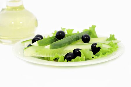 Cucumbers with olives and vegetable butter are in a bottle             の写真素材