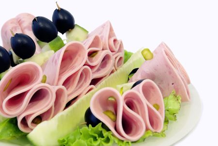 Dish in by cucumbers, lettuce and olives, beautifully decorated.                    の写真素材
