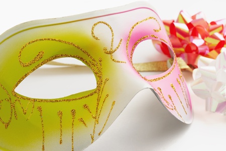 Carnival mask and coloured bows  on a white background                  の写真素材