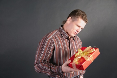 A man takes a dim view on a gift which gets on the hip           の写真素材