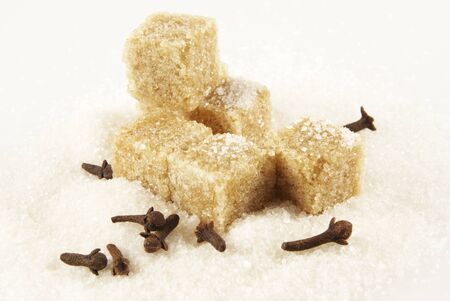 Spicinesses, pieces of brown sugar and crystals of white sugar                の写真素材
