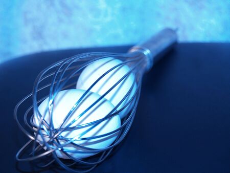 eggs in whisk blueの写真素材
