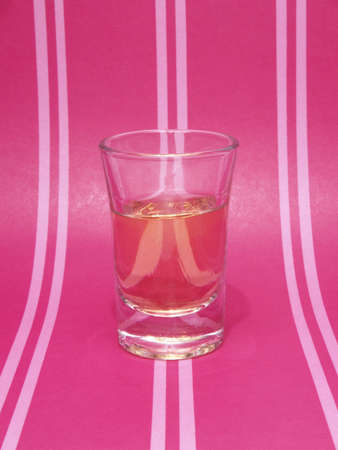 ounce shot on pink backgroundの写真素材