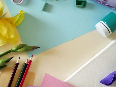 Background for congratulations, still life of artistic materials and flowers