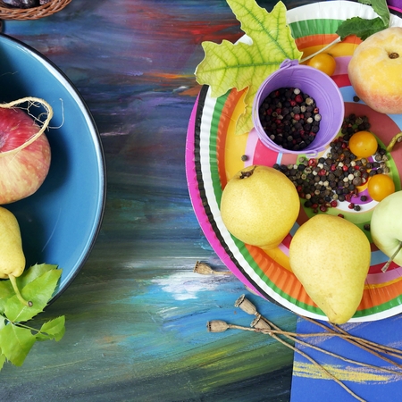 Seasonal decorative still life of bright fruits, vegetables, leaves and spices on toned blue paper, painted with pastels, top view. The concept of the season is summer, harvest, lifestyleの写真素材