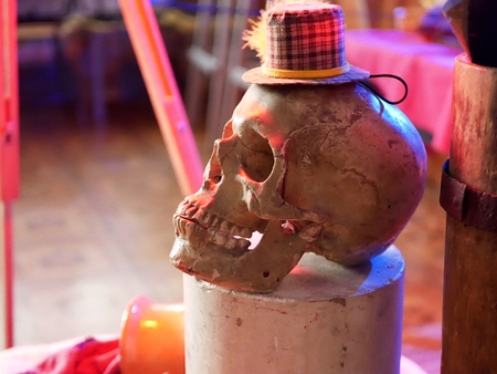 Halloween skull illuminated with red lightの写真素材
