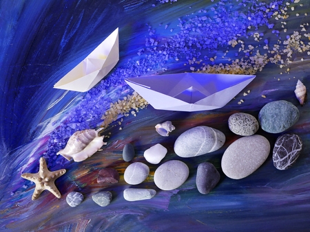 stones, sea salt, shells, starfish and paper boatsの写真素材