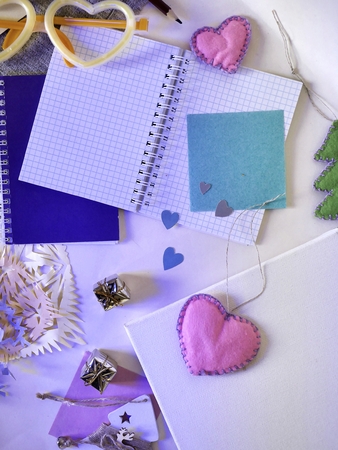 festive decor, white canvas, paper, pencils, notebookの写真素材