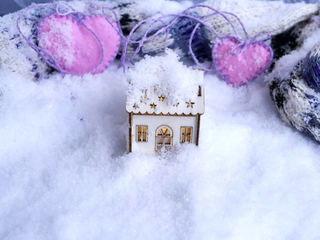 toy houses, pink hearts, snowの写真素材